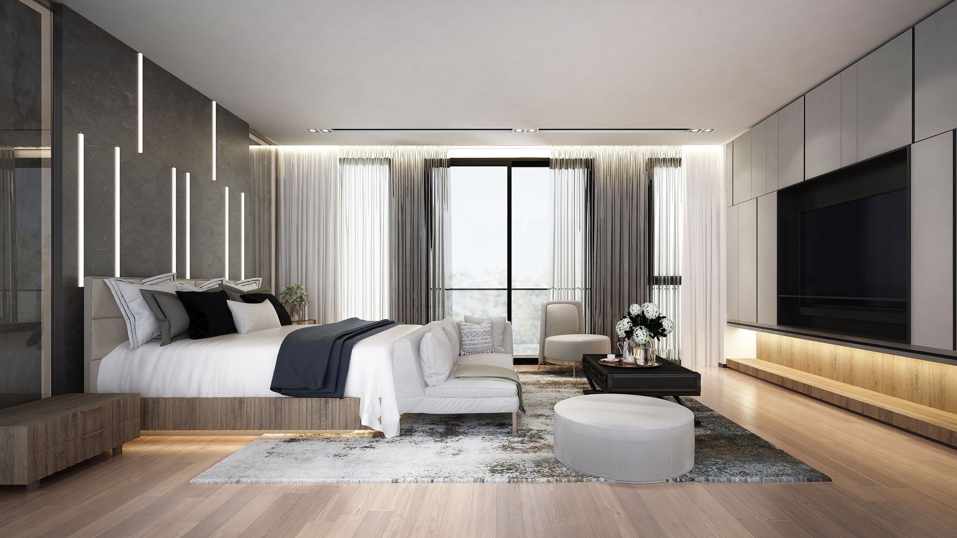 Chambre moderne avec lit, canapé et télévision. Décoration grise et blanche avec parquet.