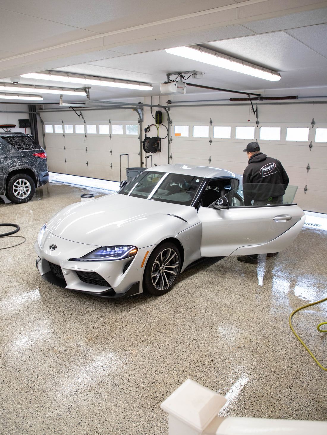 Mechanic detailing the car | Modern Auto Care