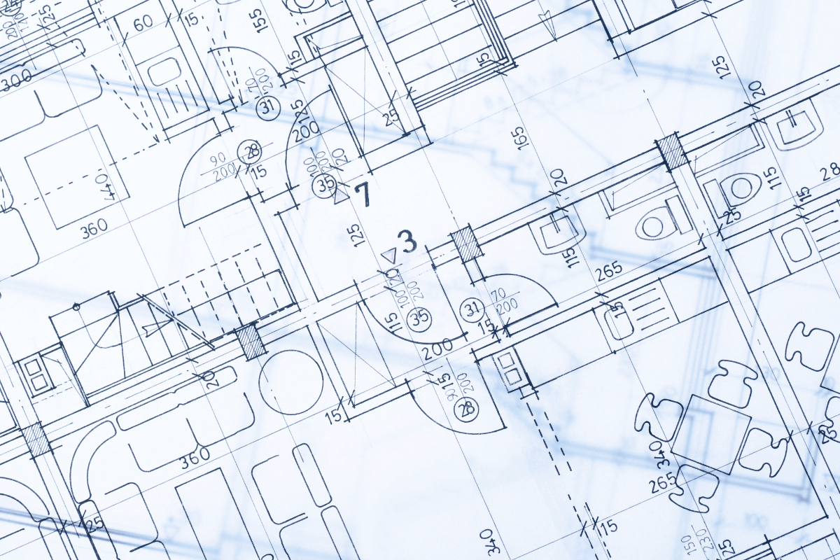 Blue architectural blueprint with building floor plan lines and measurements