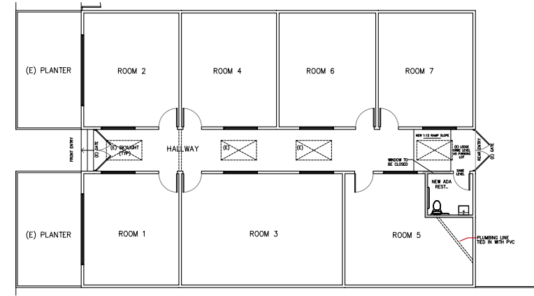 A black and white floor plan of a building with a lot of rooms.