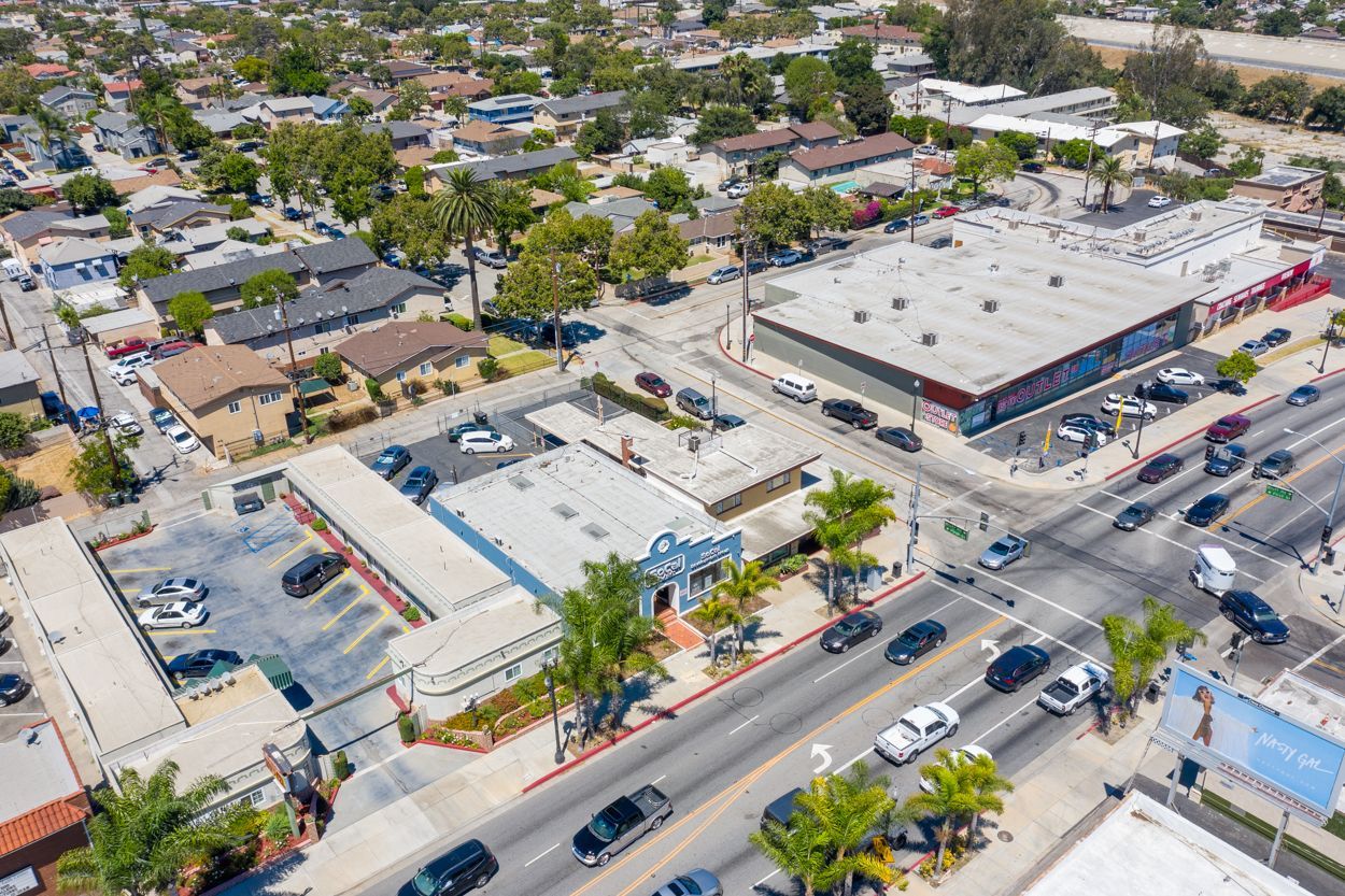 An aerial view of a city with a lot of cars and buildings.