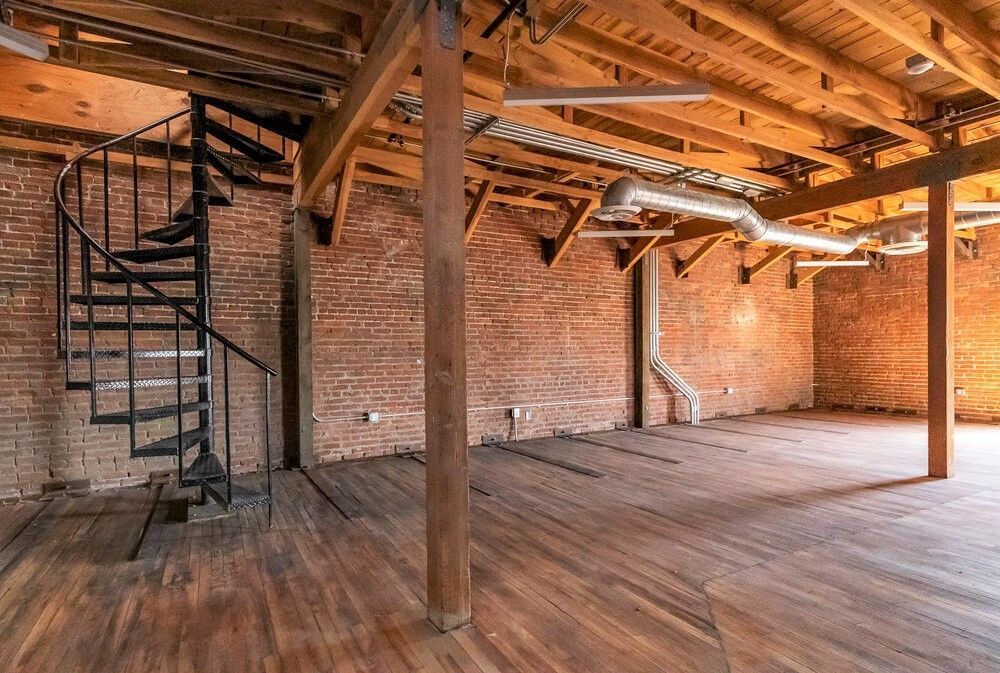 There is a spiral staircase in the middle of the room.