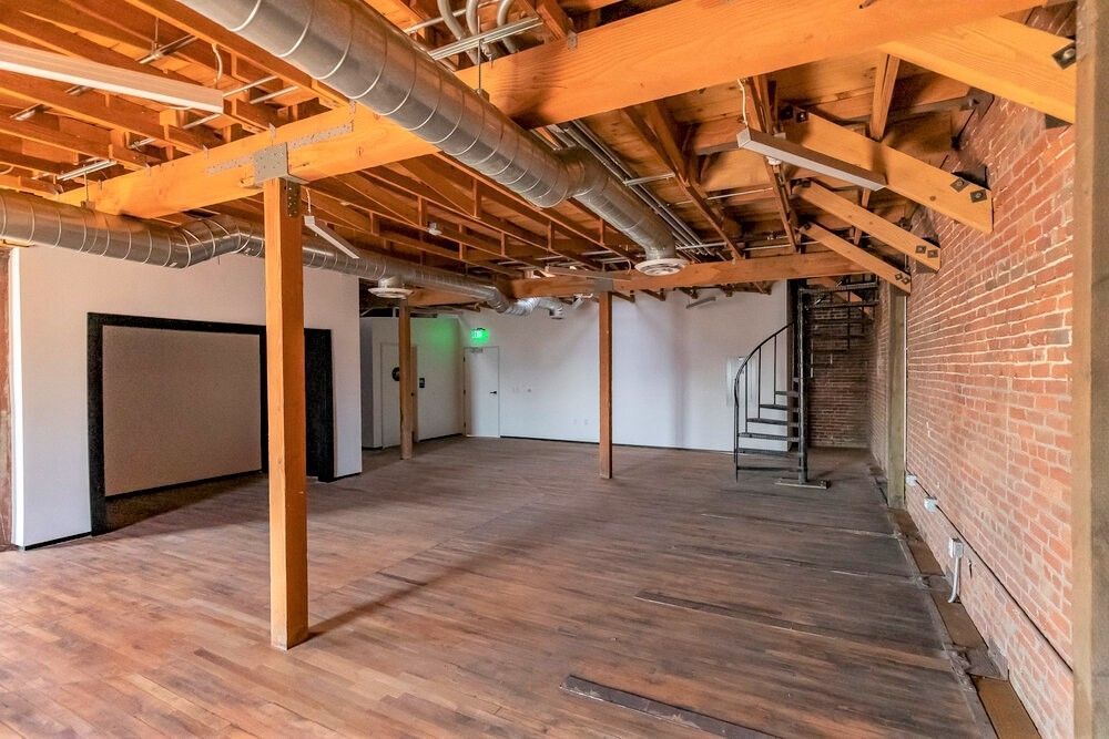 There is a spiral staircase in the middle of the room.