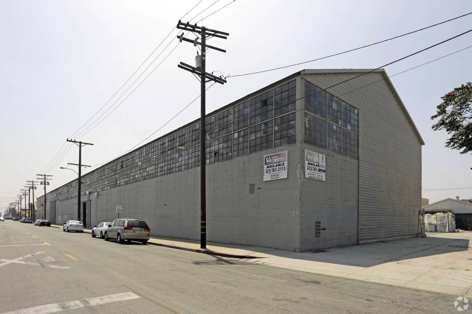 A large building with a sign on the side that says no parking