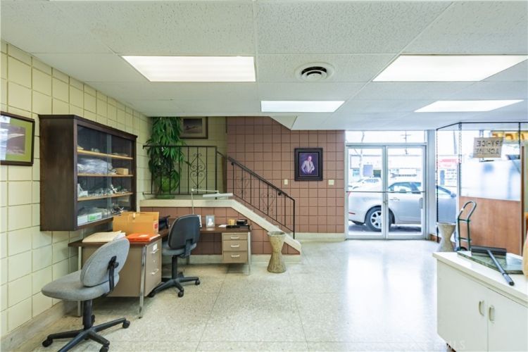 A room with a staircase leading up to the second floor