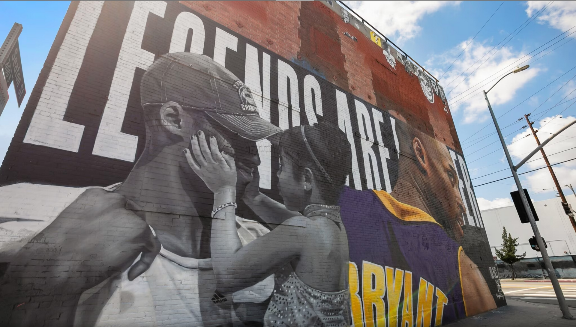 A mural on the side of a building that says legends are