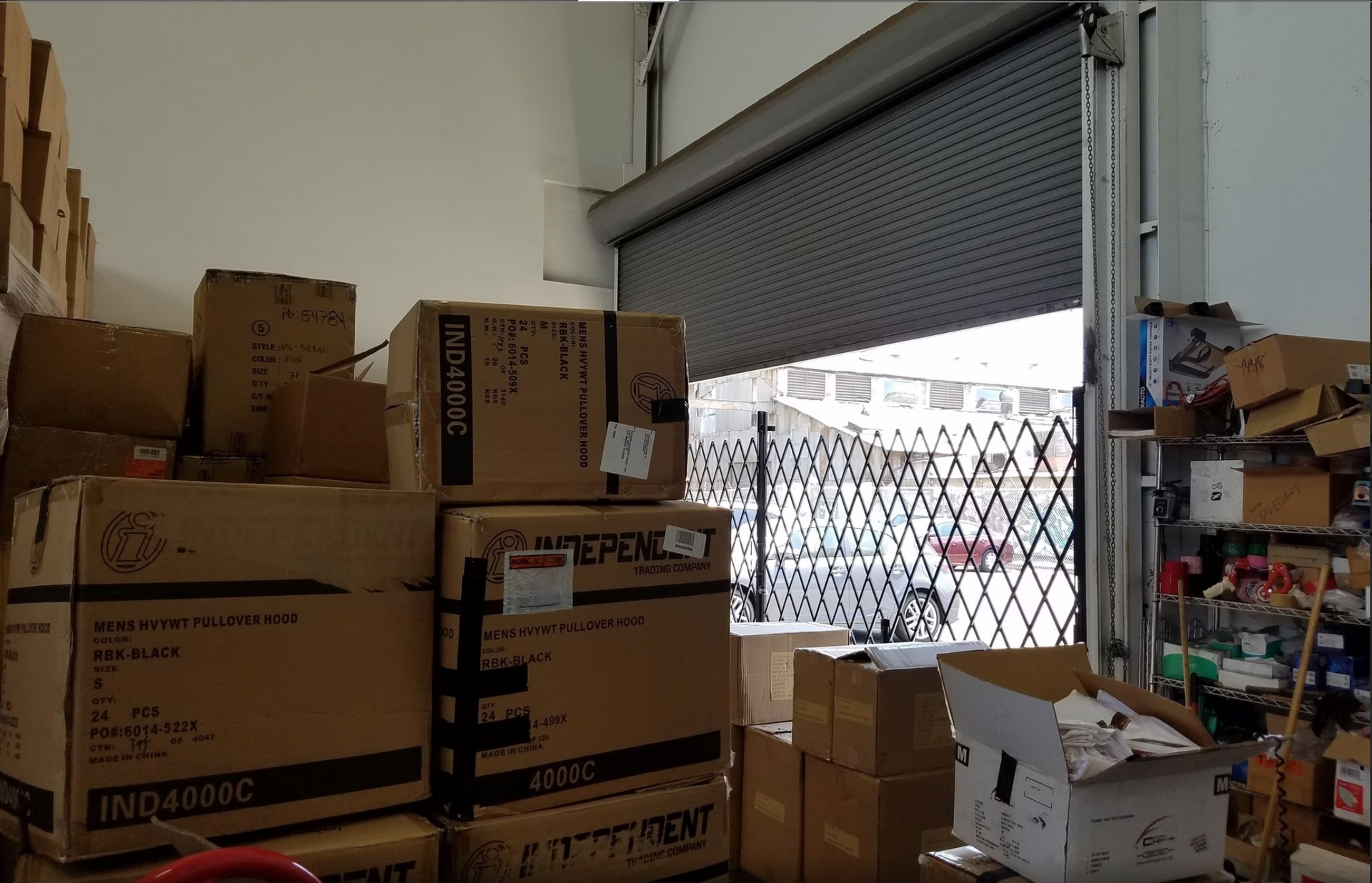 A bunch of boxes are stacked on top of each other in a warehouse