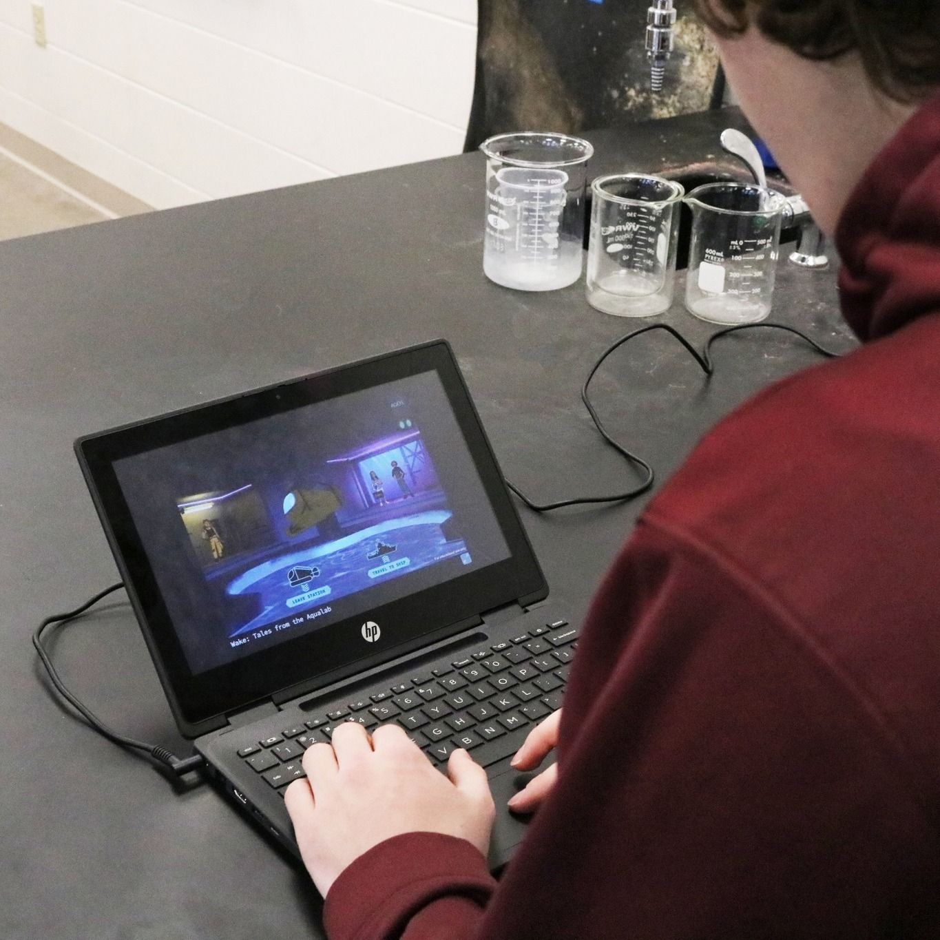 Looking over the shoulder of a student who is playing 