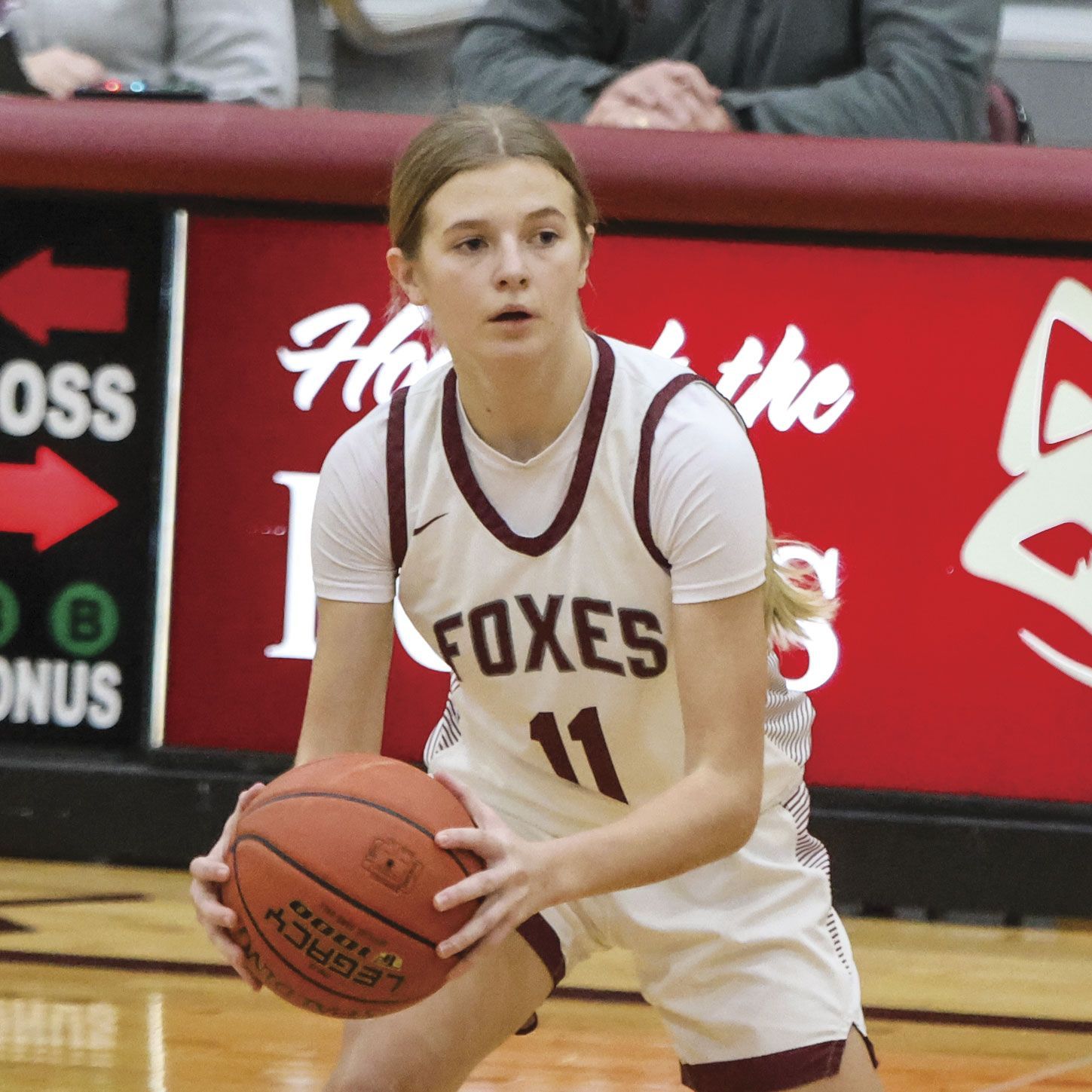 Kinley Peterson focused and with a basketball during a game