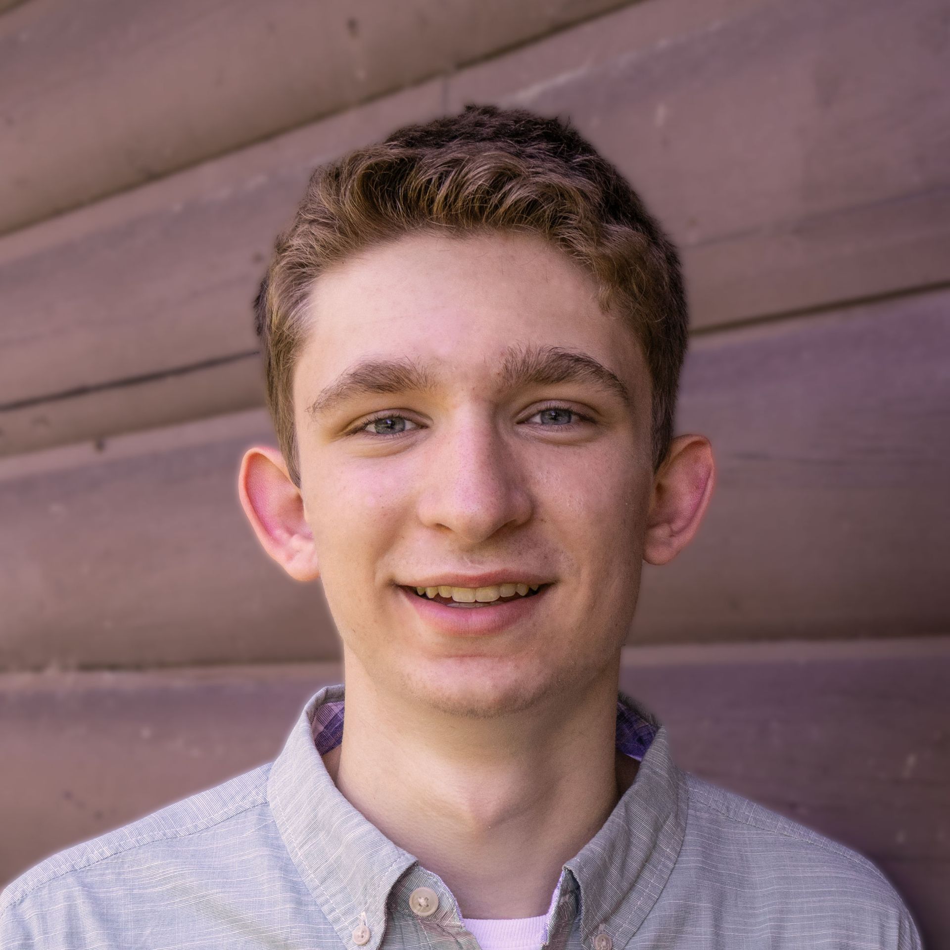 Adam Erdmann - smiling headshot - senior portrait