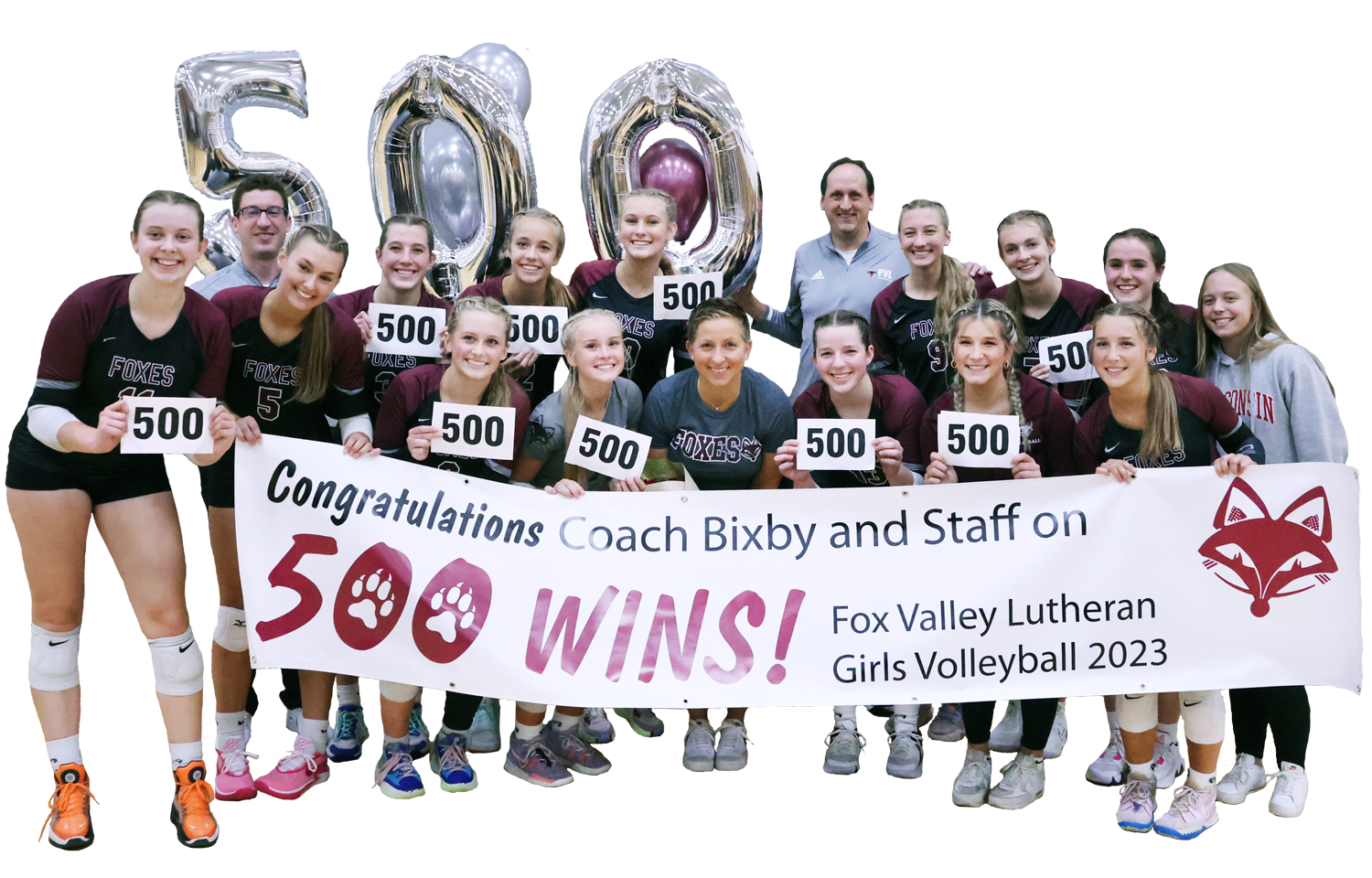 Volleyball team, each holding the number 500, a 500 wins banner in the front and balloons in the back