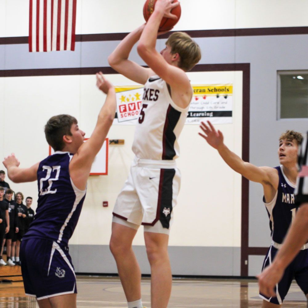 Adam Loberger shooting a basket during a game