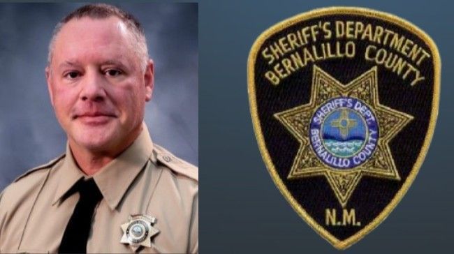 Portrait of a sheriff in tan uniform beside the Bernalillo County Sheriff’s Department badge on a blue background