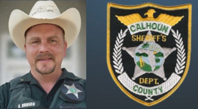 Sheriff in white cowboy hat beside Calhoun County Sheriff’s Department badge