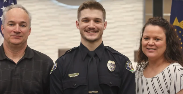 Fargo police officer Jake Wallin with his parents after he was sworn in at City Hall on April 19, 2023.