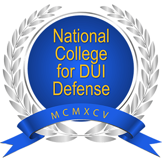 National College for DUI Defense logo with blue ribbon and silver laurel wreath