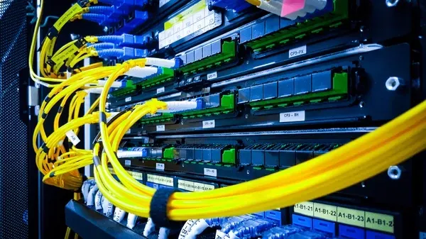 A server room filled with lots of wires and cables.