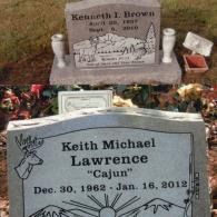 Two headstones in a grassy cemetery, one for Kenneth I. Brown and one for Keith Michael 