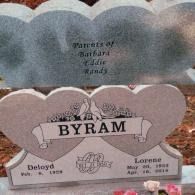 A double-heart gravestone for Deloyd and Lorene Byram, noting them as parents of Barbara, Eddie, and Randy.