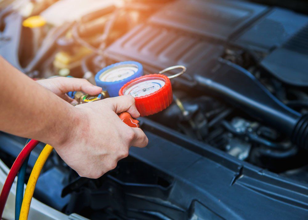 Mechanic Checking the Air Conditioner System — Automotive Batteries in Boonah, QLD