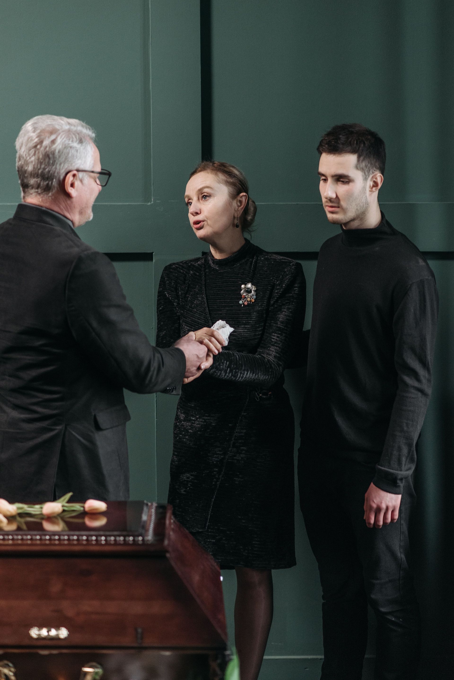 A Jacksonville family meets with a funeral director to plan a service.