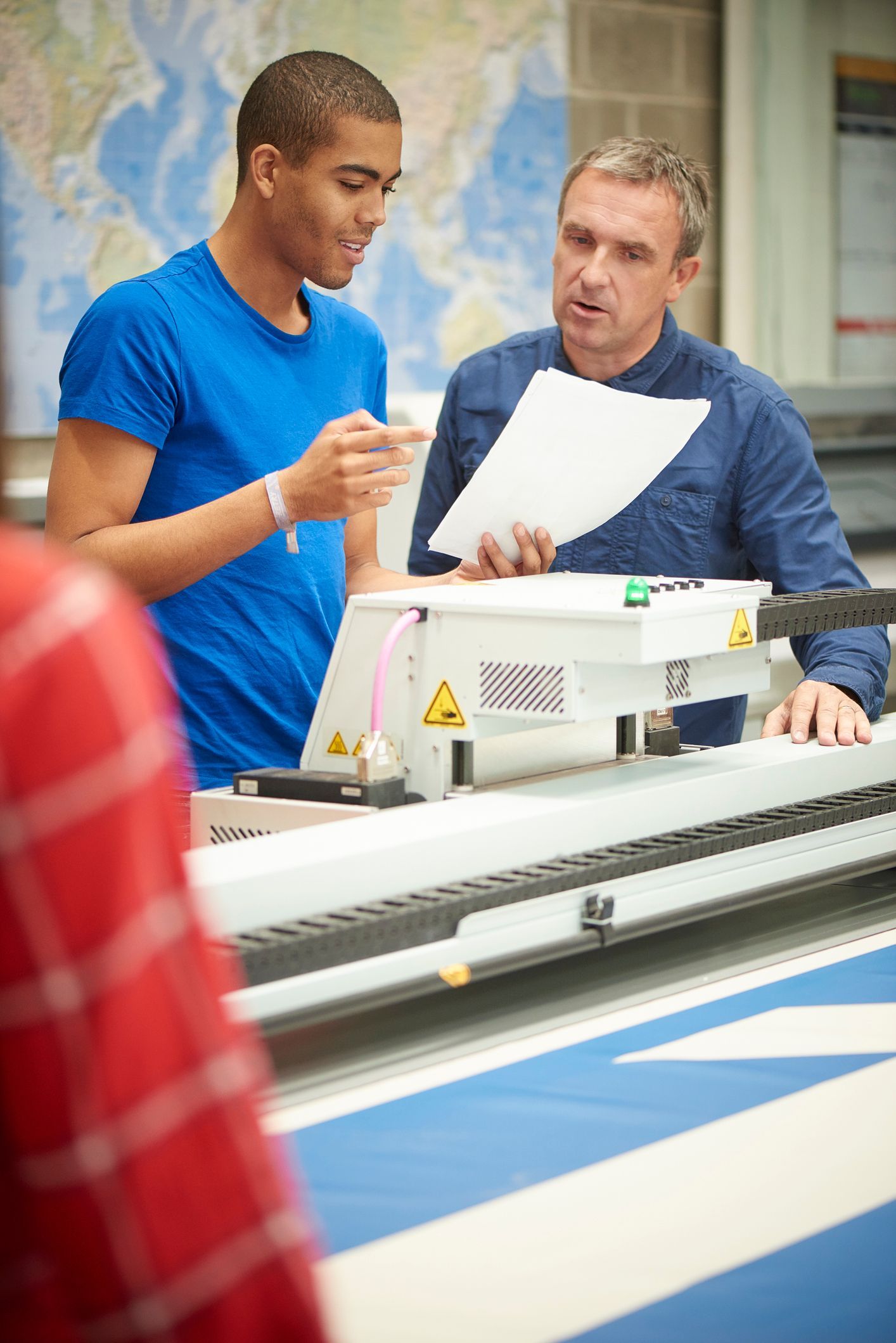 Printing specialist helping a business owner with their digital printing needs in the Hunter Region.