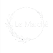 Logo for "Le March&eacute;": white text within a circle and decorative leaf accents.