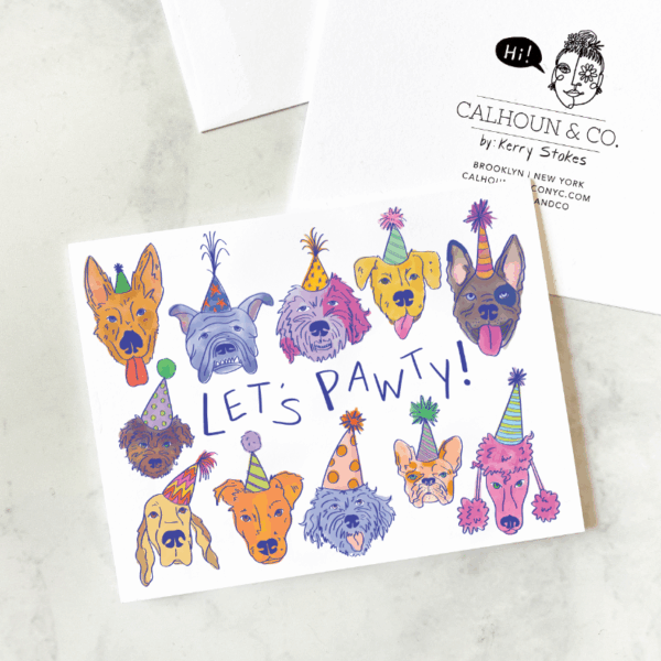 Greeting card with cartoon dog faces wearing party hats, text 