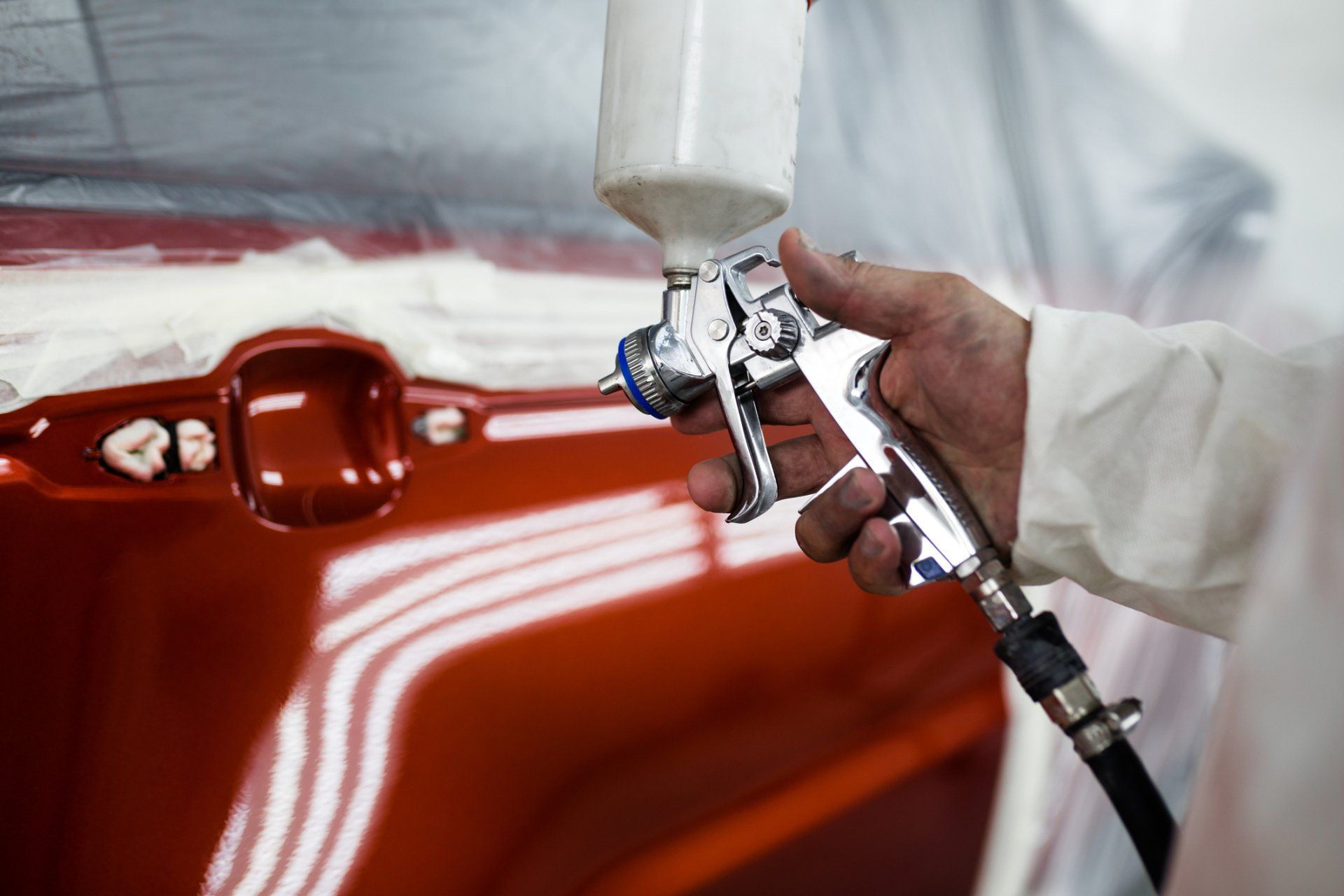 Car Tinting — Worker Applying Tinting Foil on Car Window in Philadelphia, PA