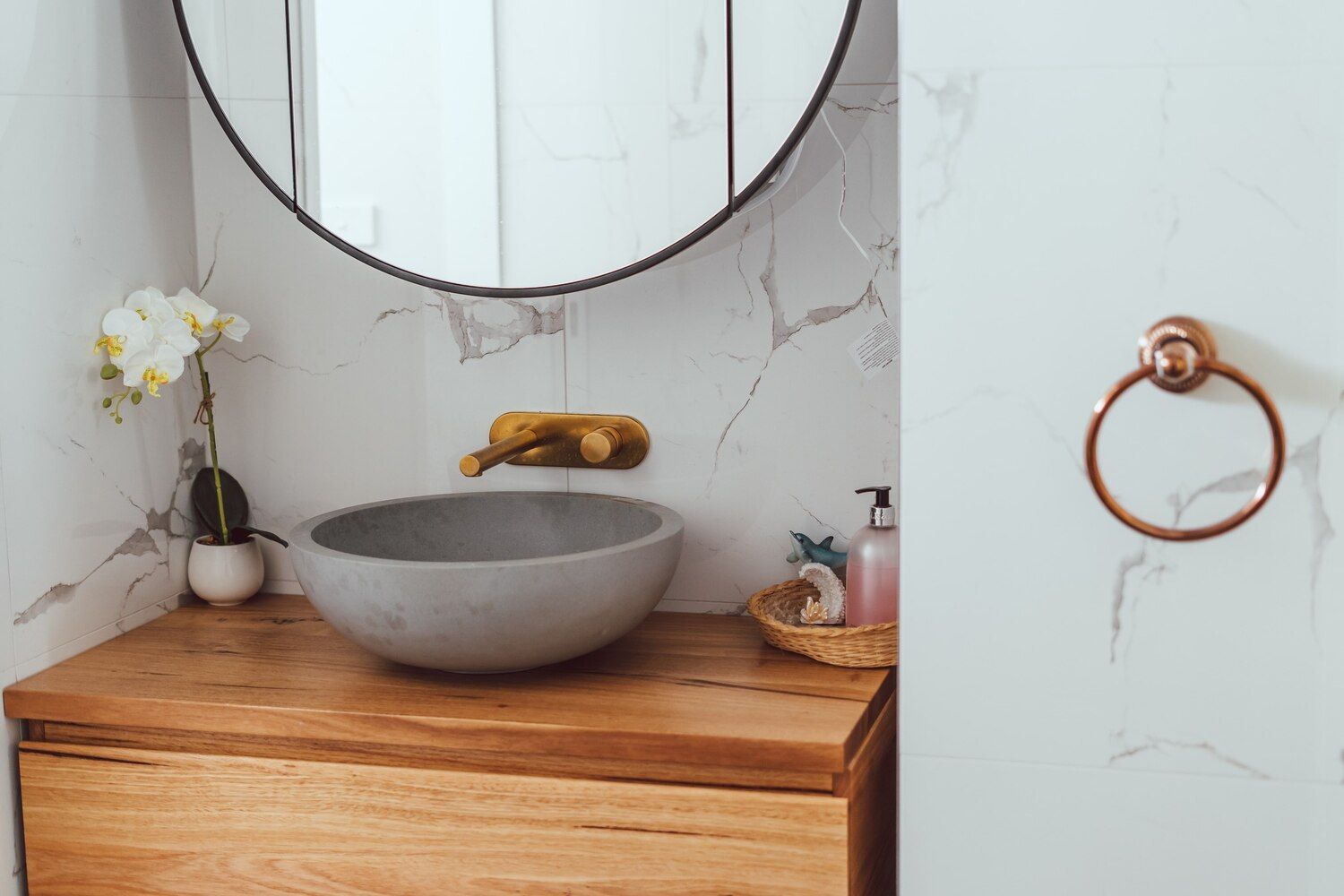 A Bathroom With A Sink , Mirror And Wooden Cabinet โ Sedah Home Improvements In Port Macquarie, NSW