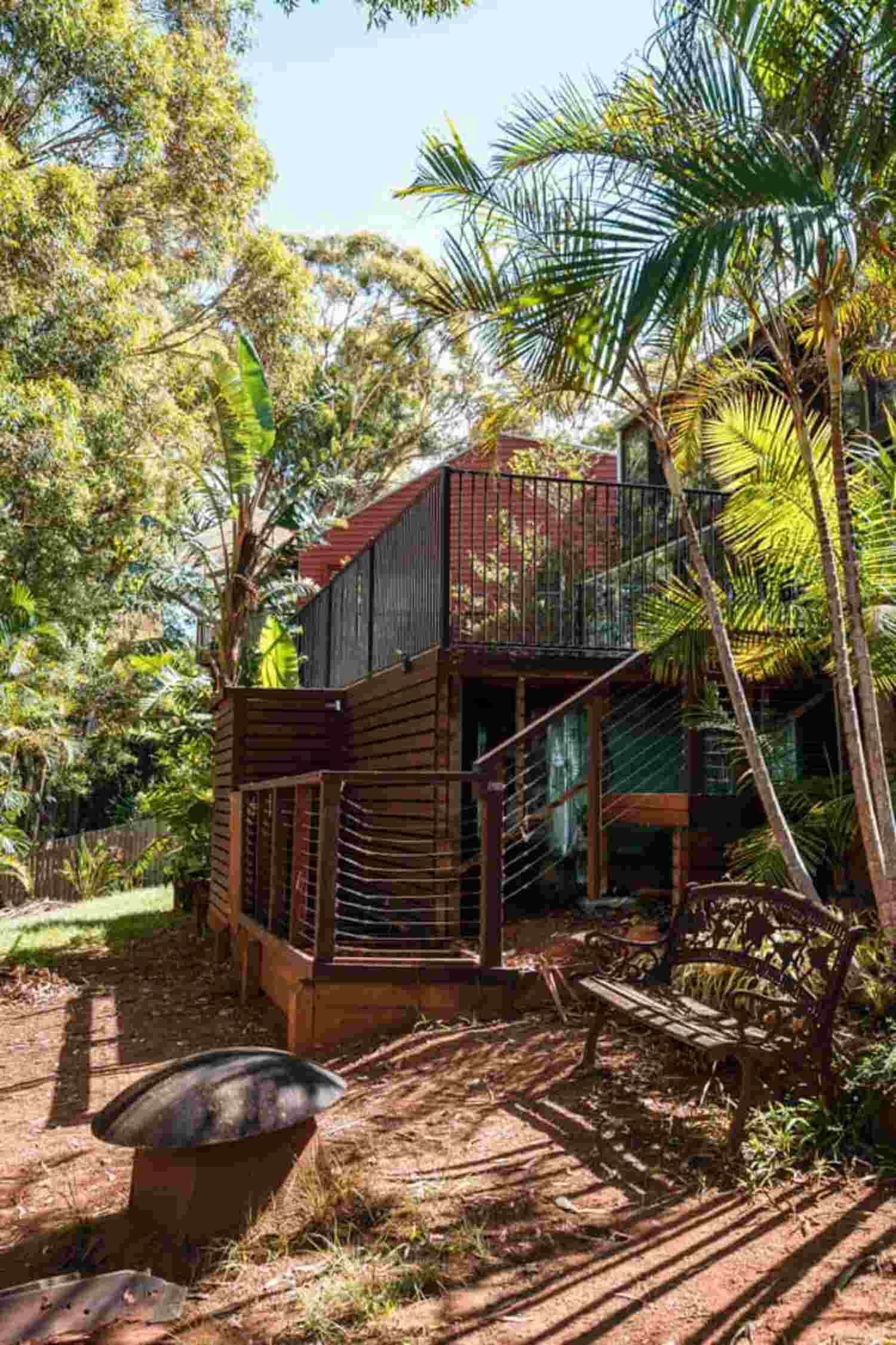 A Small House With Stairs Leading Up To It Is Surrounded By Trees โ Sedah Home Improvements In Port Macquarie, NSW