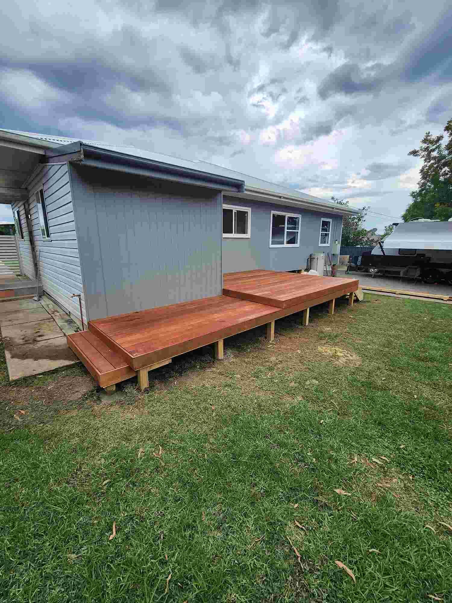 A Wooden Deck Is Being Built In Front Of A House โ Sedah Home Improvements In Port Macquarie, NSW