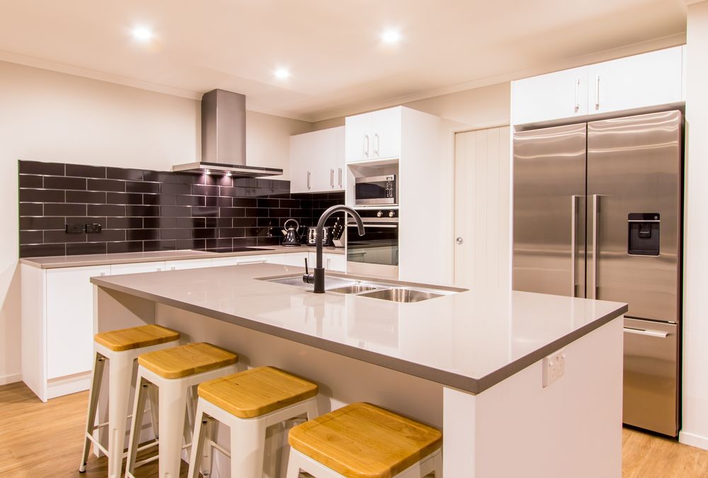 Modern kitchen with white cabinets — Stone Effects In Forest Glen, QLD