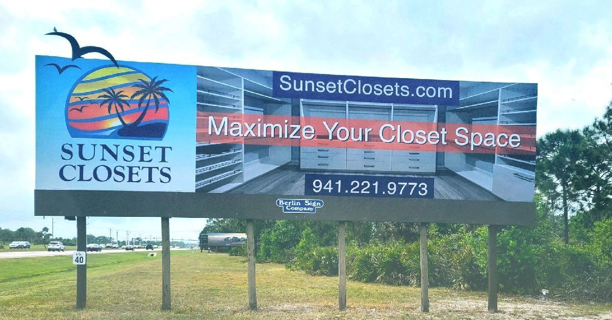 A billboard for sunset closets is on the side of the road
