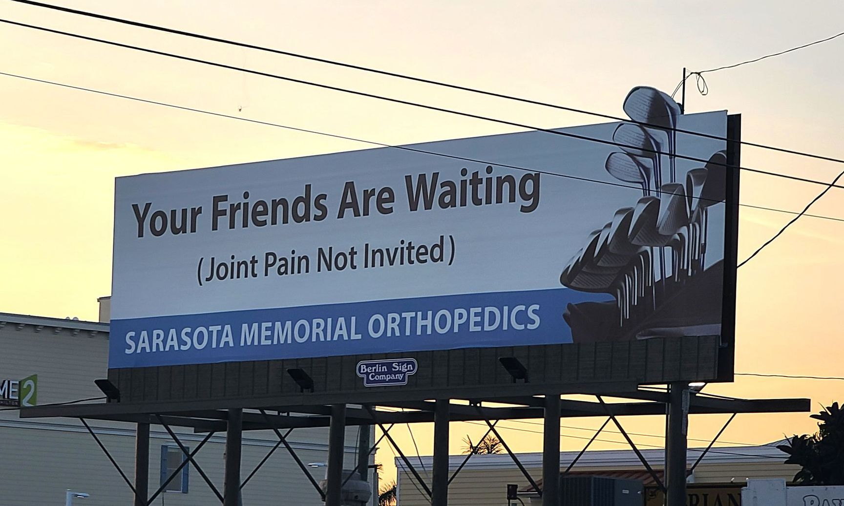 A billboard that says your friends are waiting