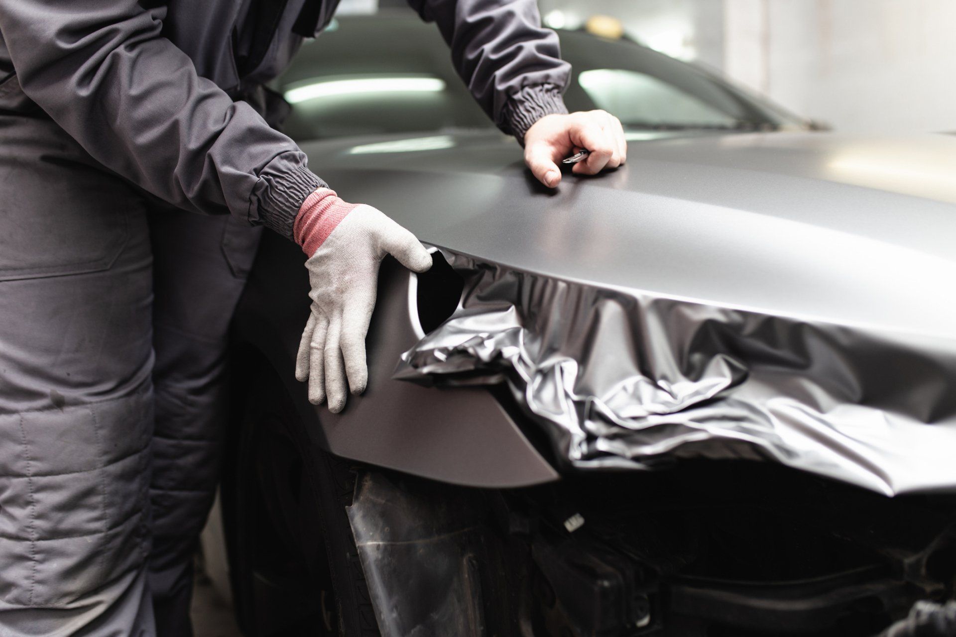 Man Installing Vinyl Wrap — Woodbridge, VA — First Class Tint & Vinyl