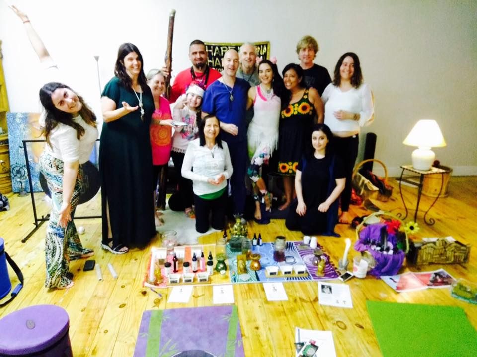 A group of people posing for a picture in a room with a sign that says ok on it