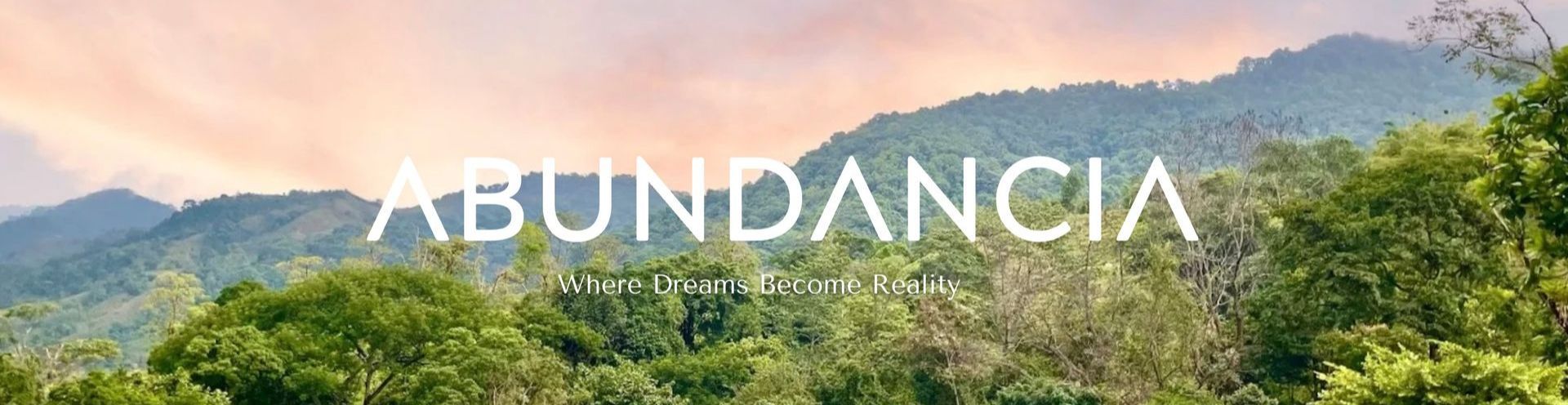 A blurred image of a forest with the words abundancia in the foreground.