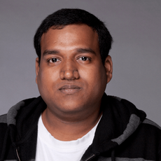 a man wearing a black hoodie and a white shirt