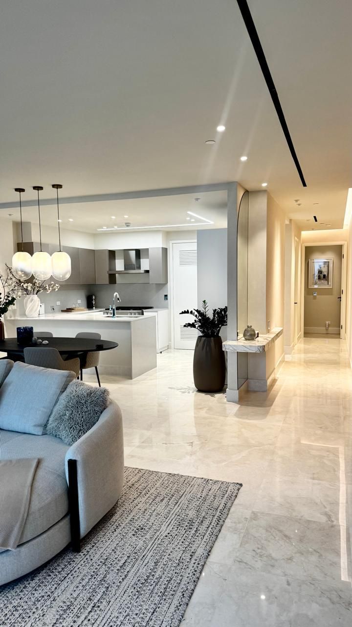 Modern, open-plan apartment interior with kitchen