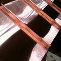 a close up of a copper pipe on a roof .