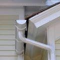 a close up of a gutter on the side of a house .