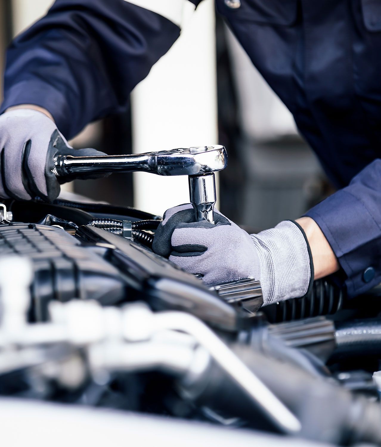 professional mechanic working on an engine