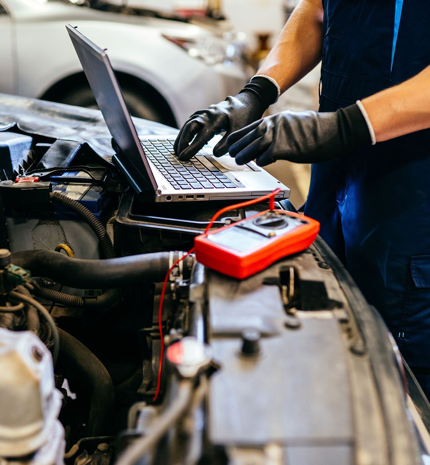 Car mechanic performing diagnostic