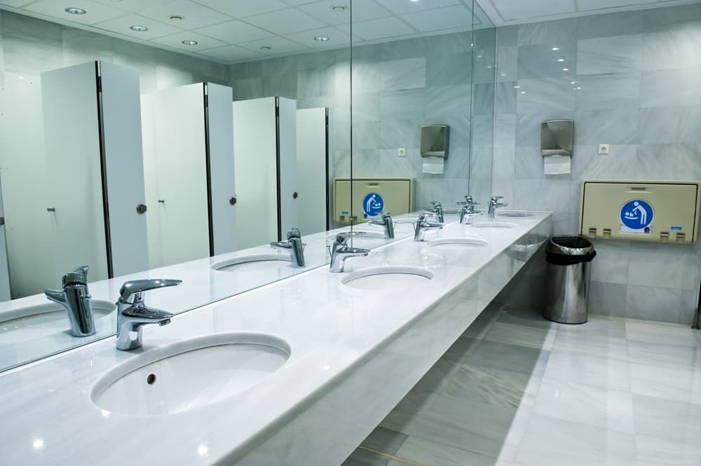 A Public Restroom with A Lot of Sinks and Mirrors — Top End Joinery In Yarrawonga, NT