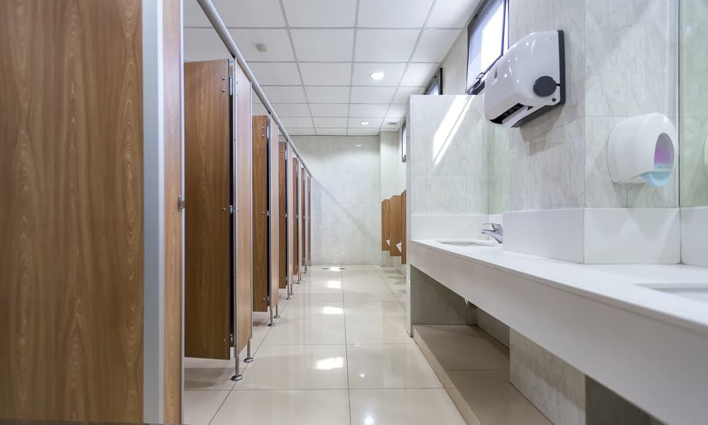 An Empty Public Restroom with Wooden Stalls — Top End Joinery In Yarrawonga, NT
