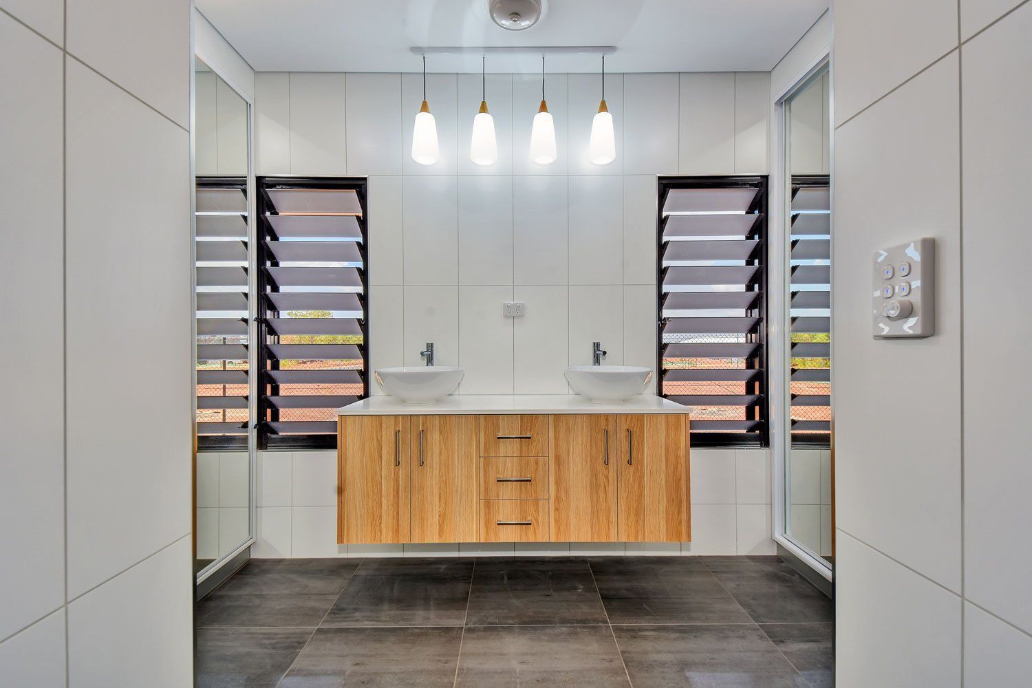 A Bathroom With Two Sinks and Two Mirrors — Top End Joinery In Palmerston, NT