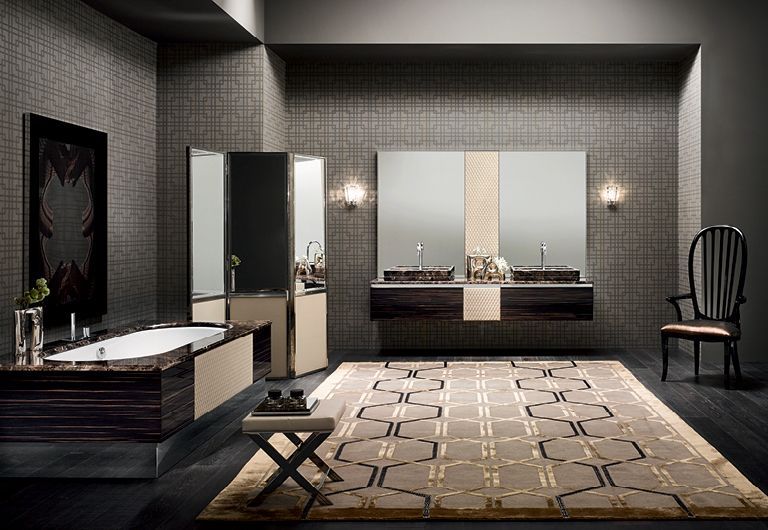 Un bagno con due lavandini, una vasca da bagno, una sedia e un tappeto.