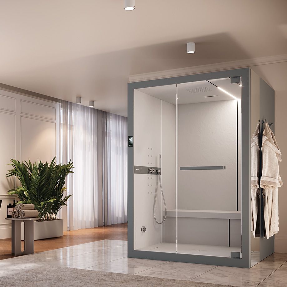 Un bagno con doccia a vapore e uno spogliatoio.