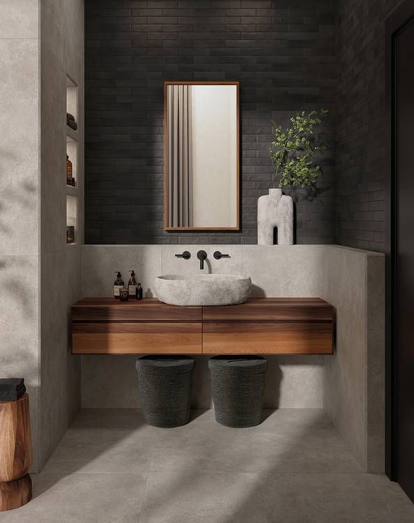 Un bagno con un lavandino e uno specchio sul muro.